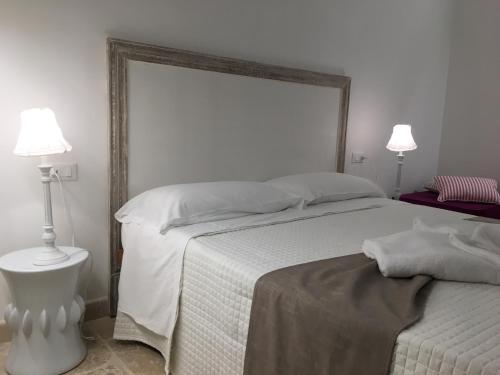 Relais Trulli Le Iconeにあるベッド