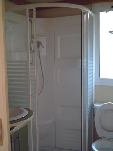 a bathroom with a shower and a toilet and a sink at Finca El Abuelo in Barbate
