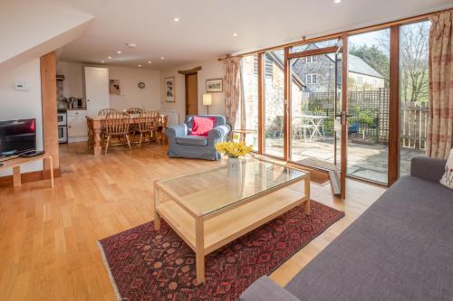 a living room with a glass coffee table at The Garlic Farm in Sandown
