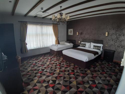מיטה או מיטות בחדר ב-Bull Inn