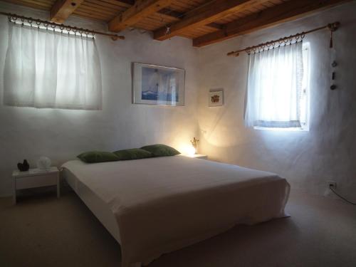 Säng eller sängar i ett rum på Guesthouse Les Mignardises
