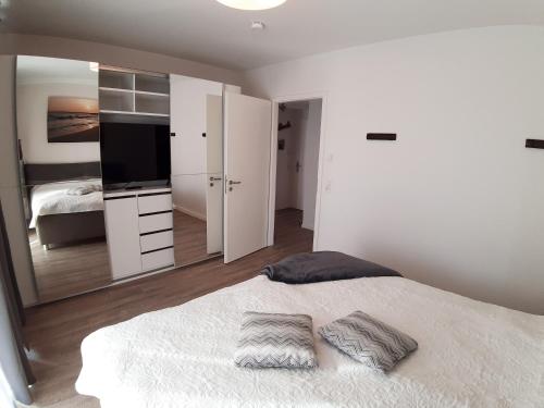 Postel nebo postele na pokoji v ubytování Ferienwohnung Strandräuber