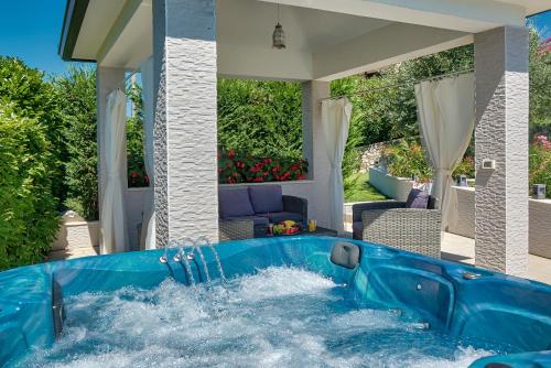 a pool in the backyard of a house at Villa Ines in Labin