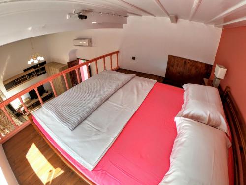 an overhead view of a bed in a room at Armonia House in Symi