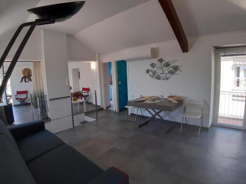 a living room with a couch and a table at La Torre by Holiday World in Bogliasco