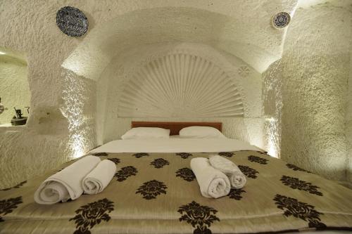Katil atau katil-katil dalam bilik di Melek Cave Hotel
