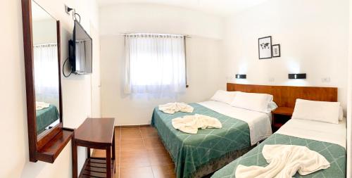 Katil atau katil-katil dalam bilik di Hotel Ramos Mejía