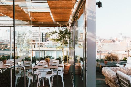 a restaurant with a view of the city at Boundary Shoreditch in London