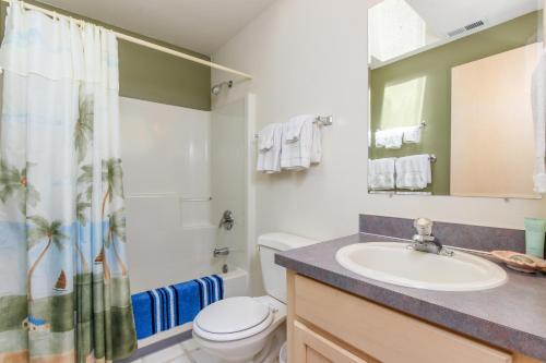 a bathroom with a sink and a toilet and a shower at Anchor Away at Lincoln City in Lincoln City