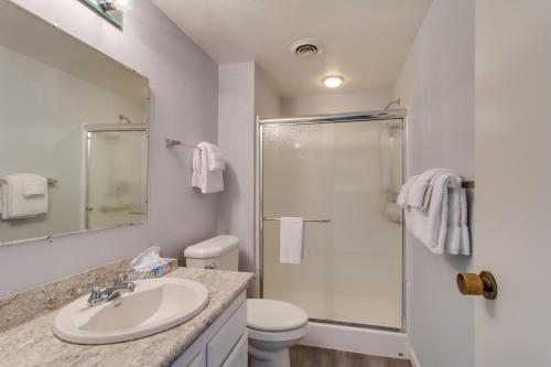 a bathroom with a shower and a sink and a toilet at Sand & Sea: The Breakers (200) in Seaside
