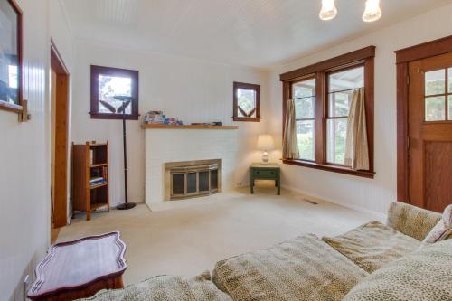 a living room with a couch and a fireplace at Spruce Landing in Gearhart