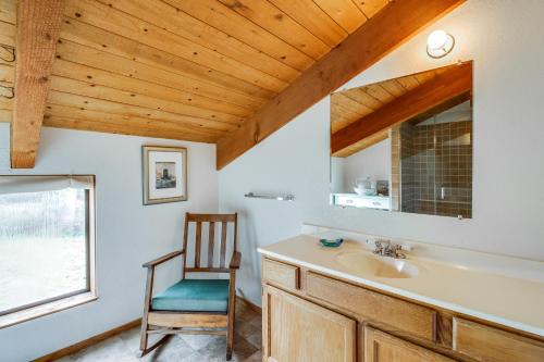 a bathroom with a sink and a wooden ceiling at Cadwalader House in Sea Ranch