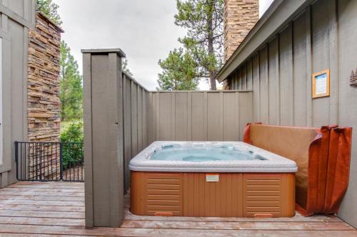 a hot tub on the side of a building at 23 Fremont Crossing Sunriver in Sunriver