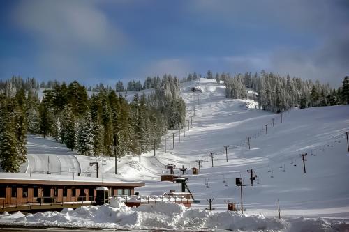 a snow covered ski slope with a ski lift at Sisters Tollgate Retreat with Hot Tub & WiFi in Sisters
