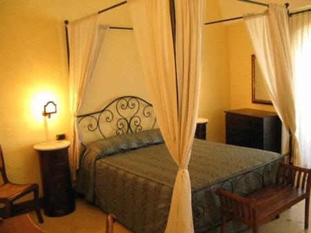 เตียงในห้องที่ B&B Palazzo Senape De Pace