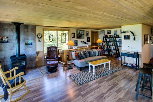 a living room with a couch and a fireplace at The Beach House on Lopez Island in Lopez