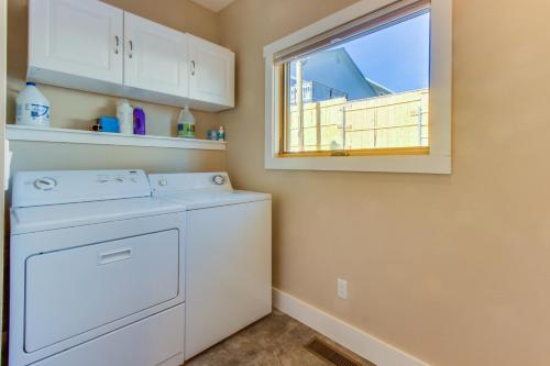 a washer and dryer in a laundry room with a window at Durango Deluxe Townhome in Durango
