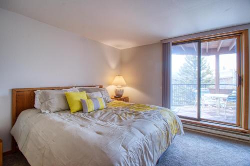 a bedroom with a bed and a large window at Lakeview Marina Place in Dillon
