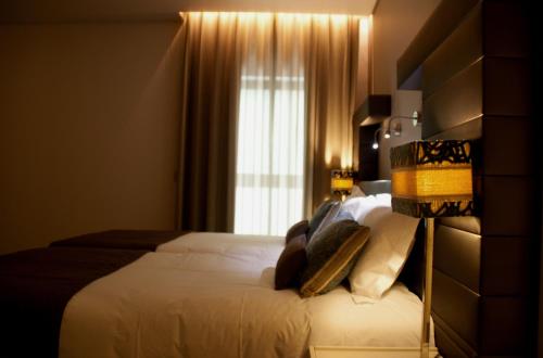 Uma cama ou camas num quarto em Aqua Ria Boutique Hotel