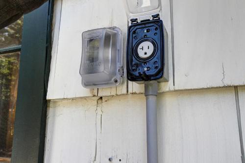 a meter on the side of a wall with aplug at The Crow's Nest in Idyllwild