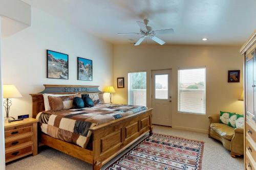 a bedroom with a bed and a ceiling fan at Rim Village Q4 in Moab