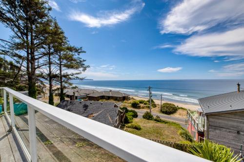 a view of the ocean from the balcony of a house at Hale Kaalawai in Oceanside