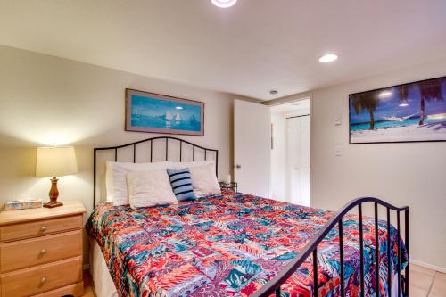 a bedroom with a bed and a nightstand and a bed sidx sidx sidx sidx at Hale Kaalawai in Oceanside