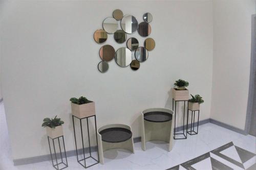 a room with four stools and mirrors on the wall at CREVICE HOTEL in Davao City