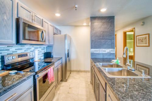 a kitchen with a sink and a refrigerator at Lakeview Marina Place in Dillon