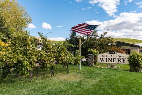 a sign and an american flag in front of a winery at Clear Water in Shrine Beach