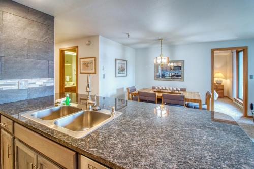 a kitchen with a sink and a living room at Lakeview Marina Place in Dillon