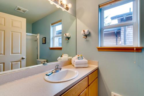 a bathroom with a sink and a mirror at Ride the Wave (MCA #439) in Manzanita