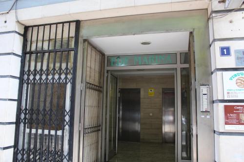an entrance to a building with a sign that reads do warmite at Marina Suite in Santa Cruz de Tenerife