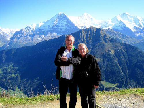 a man and woman standing on top of a mountain at Pension Stubachblick in Uttendorf