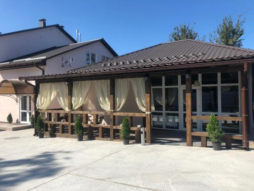 a building with curtains in front of it at Guest House SOTNI in Kyiv