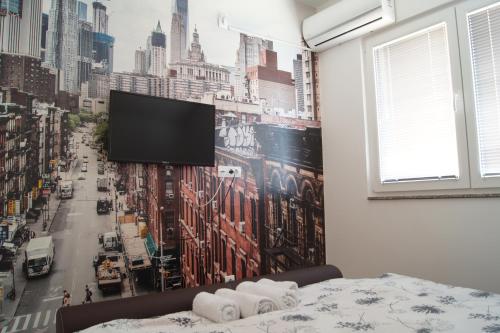 Televizorius ir (arba) pramogų centras apgyvendinimo įstaigoje SOBE ROOMS GAVRILO