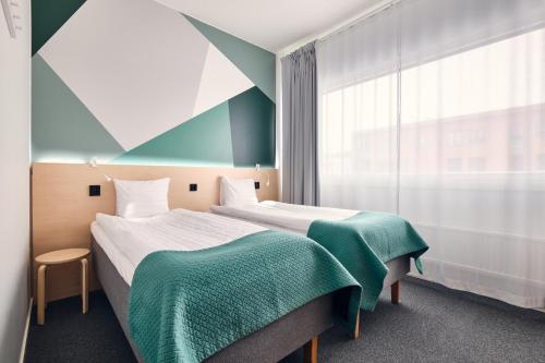 Voodi või voodid majutusasutuse GreenStar Hotel Jyväskylä toas