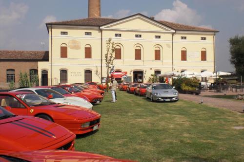 a group of cars parked in front of a building at Ristorante Alloggio Ostello Amolara in Adria