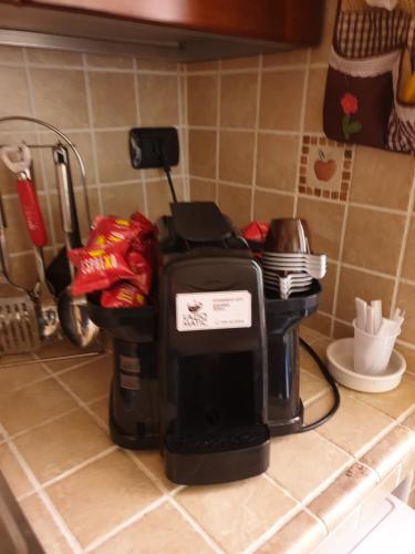 a coffee maker sitting on a kitchen counter at Portella delle Fate in Sora