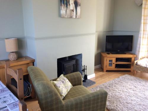 A television and/or entertainment center at Highland Holiday House 