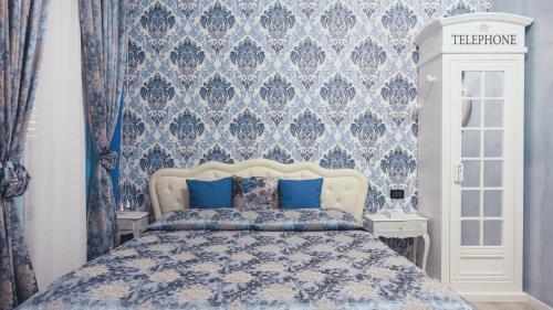 A bed or beds in a room at L'Antenna