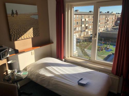 Postel nebo postele na pokoji v ubytování Hotel Zee en Duin