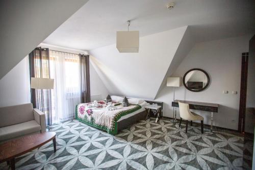 En eller flere senge i et værelse på ApartHotel Tatry de Luxe FizjoMedical & Spa