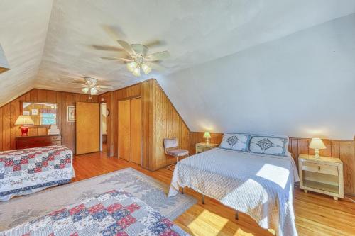a bedroom with a bed and a ceiling fan at Adirondack Adventuring in Brant Lake