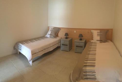 Ένα ή περισσότερα κρεβάτια σε δωμάτιο στο Ma Ré Basse