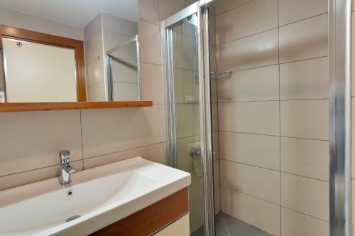 a bathroom with a sink and a shower at Upart Home in Mersin