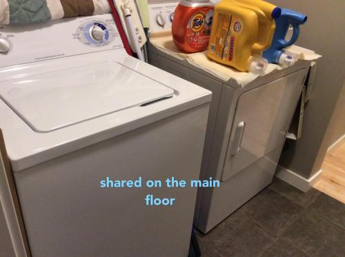 a small refrigerator with a sink in a kitchen at 民宿Ann's House in Calgary in Calgary