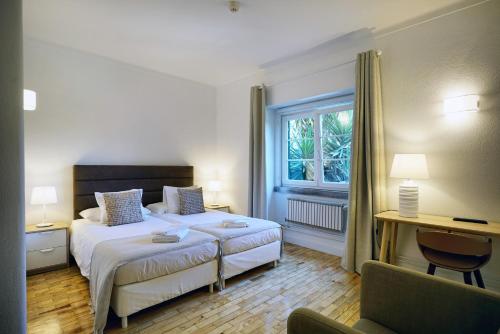 Postel nebo postele na pokoji v ubytování Comfy Sintra