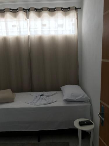 Ένα ή περισσότερα κρεβάτια σε δωμάτιο στο Pousada Anjos da Montanha