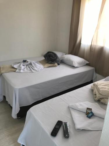Ένα ή περισσότερα κρεβάτια σε δωμάτιο στο Pousada Anjos da Montanha